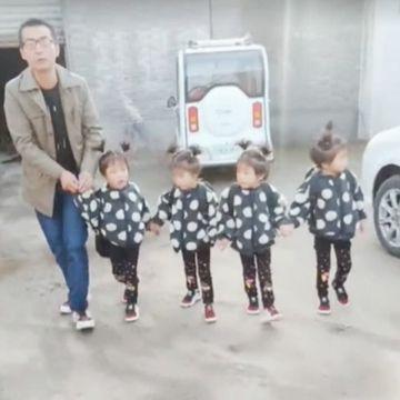 爸爸送四胞胎女儿去上学，路人投来羡慕的目光，四个宝贝太萌了