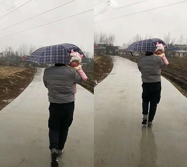 带宝宝出门遇上下雨，爸爸举起宝宝当雨伞，网友：父爱如山体滑坡